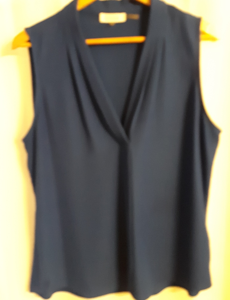 Never worn sleeveless deep blue top